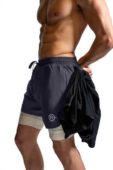 Men's black athletic shorts with elastic waistband, side ties, and light gray lining