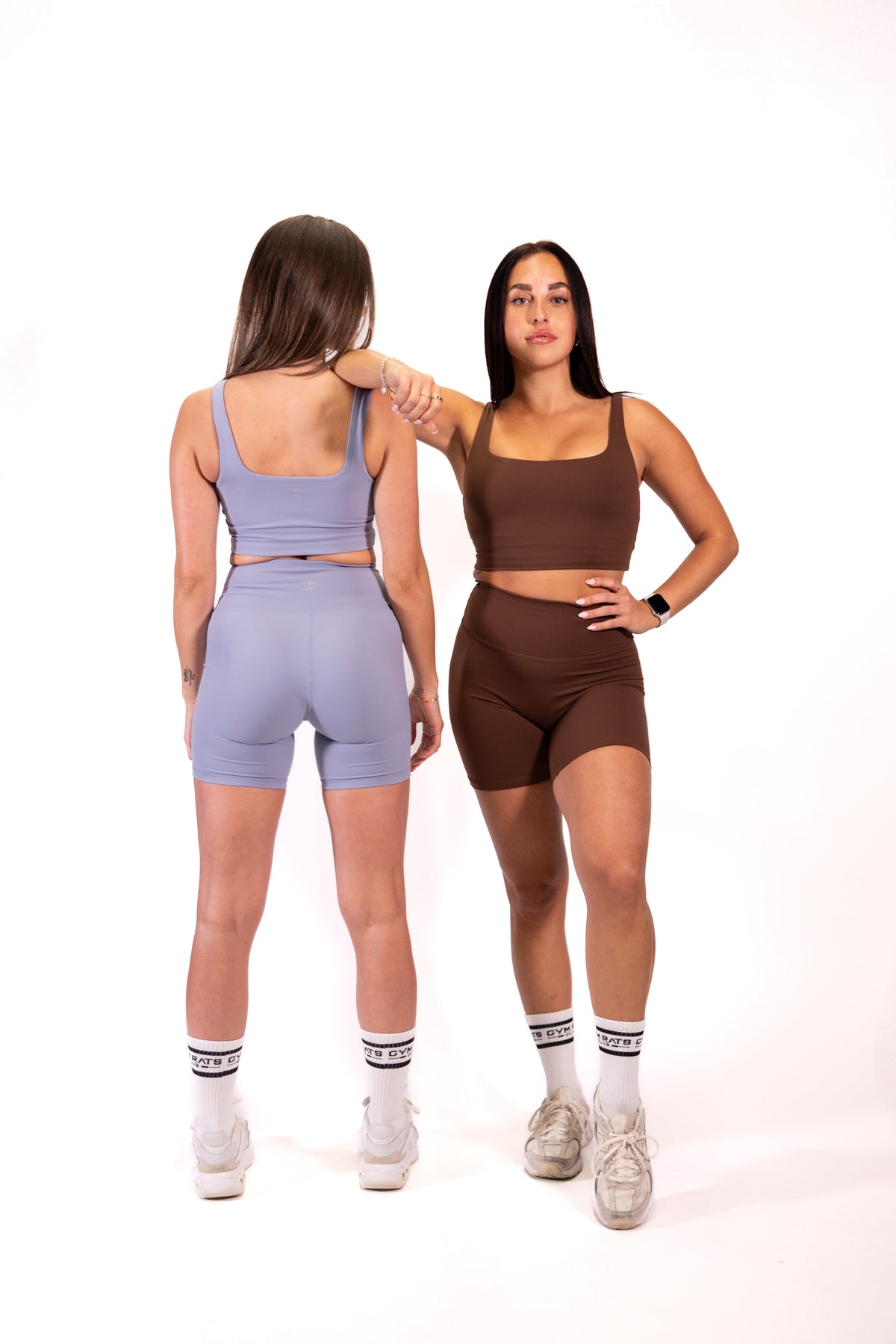 Blue long-cut sports bra with racerback straps, shown with matching shorts