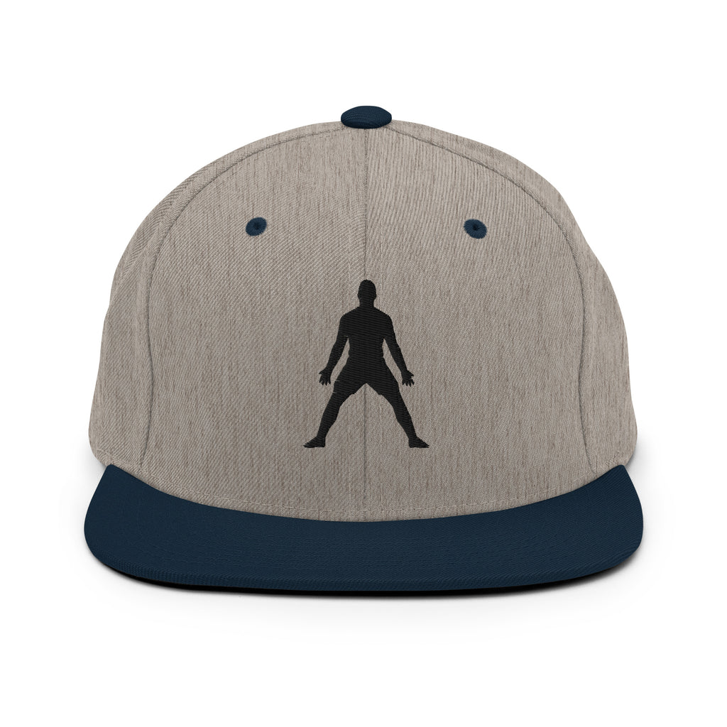 Natural beige snapback hat with 3D puff embroidered standing silhouette on front, blue brim