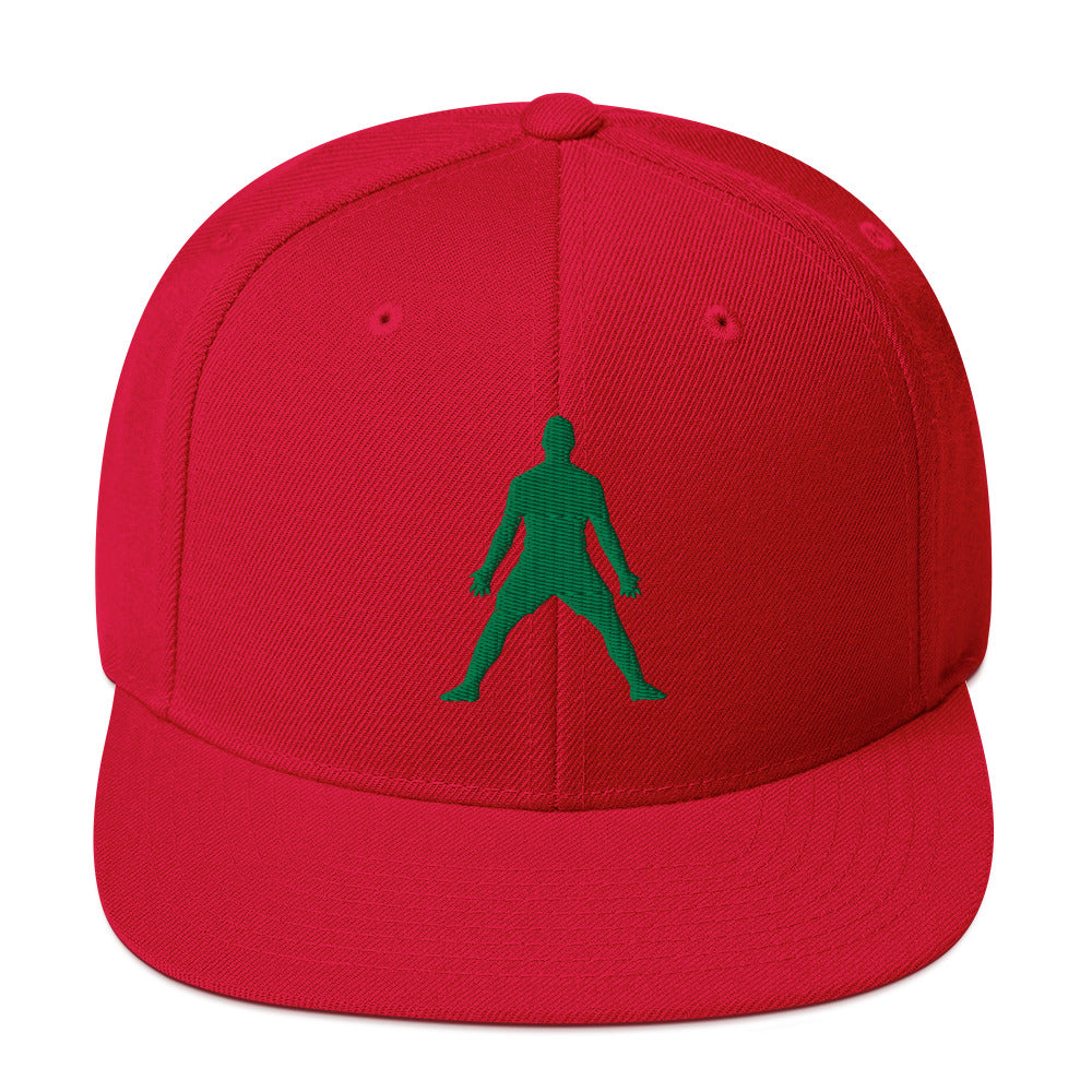Red snapback hat with 3D puff embroidered green silhouette front panel.