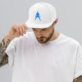 White snapback hat with blue silhouette embroidery worn by a person
