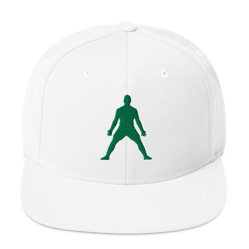 White snapback hat with green 3D puff embroidered figure graphic on front