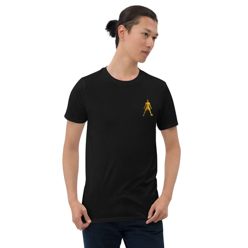 Black unisex T-shirt with golden walking silhouette graphic on the chest, crew neck, worn.