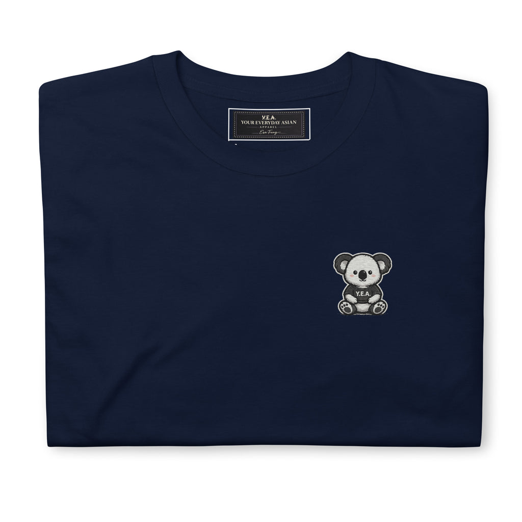 Unisex embroidered tee in navy blue with small bear graphic on the chest